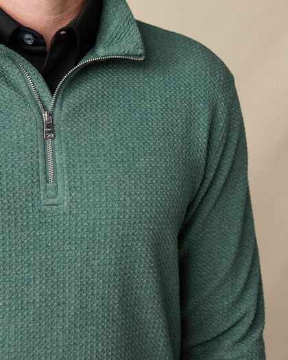 Close-up of the Topanga Quarter Zip in Dark Forest, featuring textured knit fabric, a metal quarter-zip closure, and stand collar.