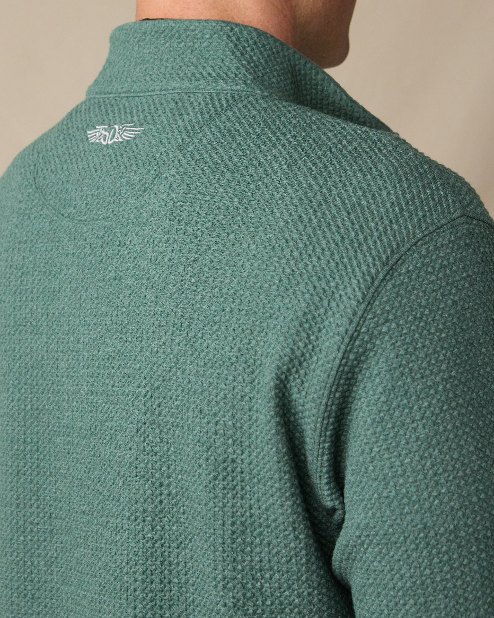 Back view of the Topanga Quarter Zip in Dark Forest, highlighting the textured knit and embroidered Straight Down logo below the collar.