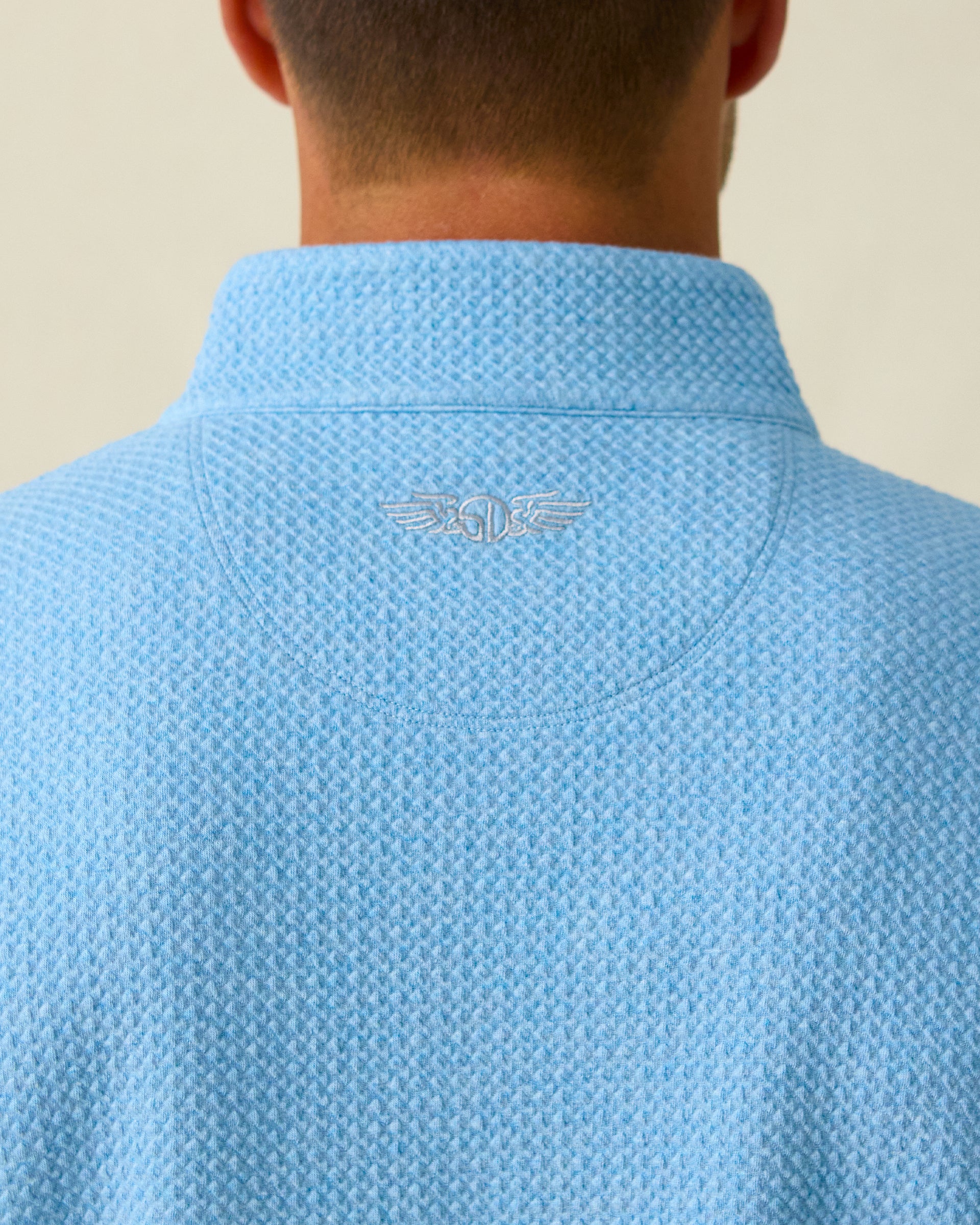 Men's Topanga Quarter Zip in Coastal, back collar detail view featuring a tonal embroidered Straight Down logo on a medium blue raised diamond textured fabric
