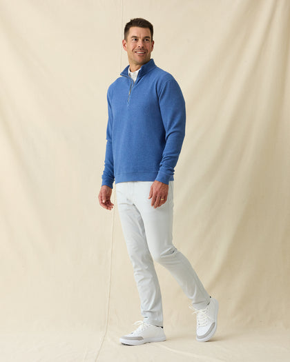 Men's Topanga Quarter Zip in Moonlight, full length front view on model featuring a bubble knit texture with silver zipper, layered over a white polo, paired with white pants and white shoes