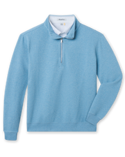 Light blue quarter zip pullover with bubble knit texture layered over white polo