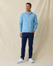 Men's Topanga Quarter Zip in Coastal, full length model view featuring a medium blue long sleeve quarter zip pullover with an allover raised diamond textured fabric, layered over a white polo, styled with navy pants and white shoes