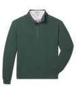 A dark green waffle-knit quarter-zip pullover sweater with a white polo underneath.