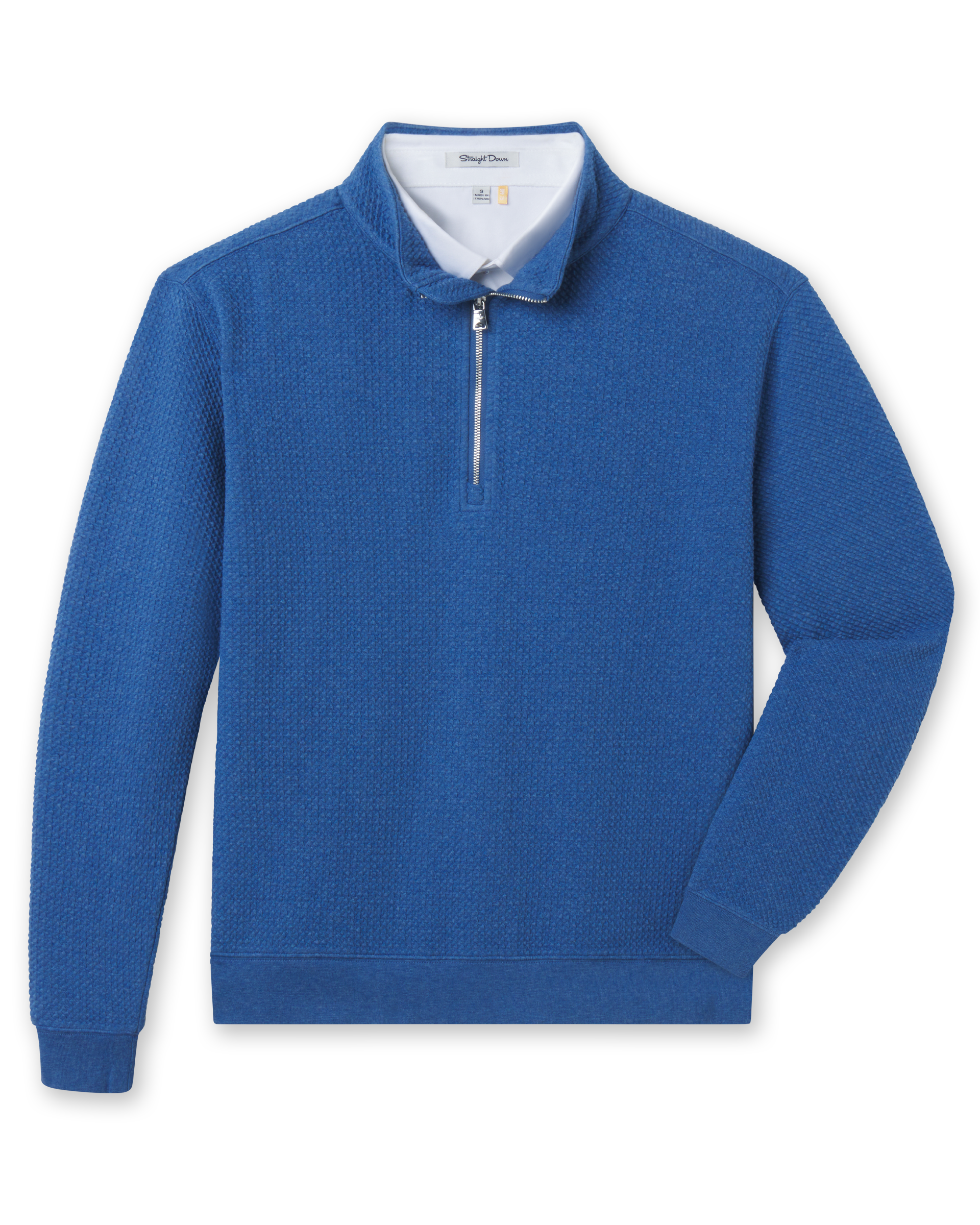 Blue bubble knit quarter zip layered over a white polo