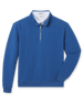 Blue bubble knit quarter zip layered over a white polo