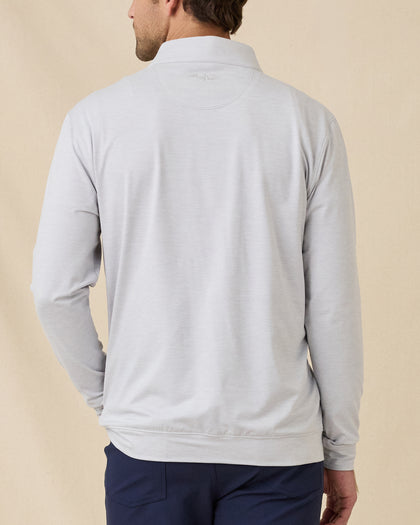 Back view of model wearing the Palmer Quarter Zip in Heather, showing the clean back design and embroidered logo below the collar.