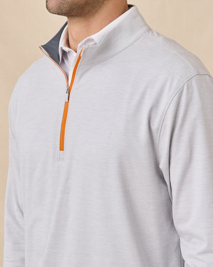 Close-up of the Palmer Quarter Zip in Heather showing the stand collar, heathered fabric, and contrasting orange quarter-zip closure.