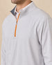Close-up of the Palmer Quarter Zip in Heather showing the stand collar, heathered fabric, and contrasting orange quarter-zip closure.