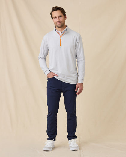Full-length view of model wearing the Palmer Quarter Zip in Heather with navy pants and white sneakers.