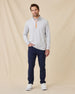 Full-length view of model wearing the Palmer Quarter Zip in Heather with navy pants and white sneakers.