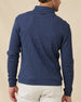 Back view of a male model wearing the Huntington Quarter Zip in New Indigo, highlighting the textured waffle knit and embroidered logo below the back collar.