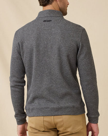 Rear view of the black Huntington Quarter Zip, showing the textured waffle knit and embroidered logo below the back collar.