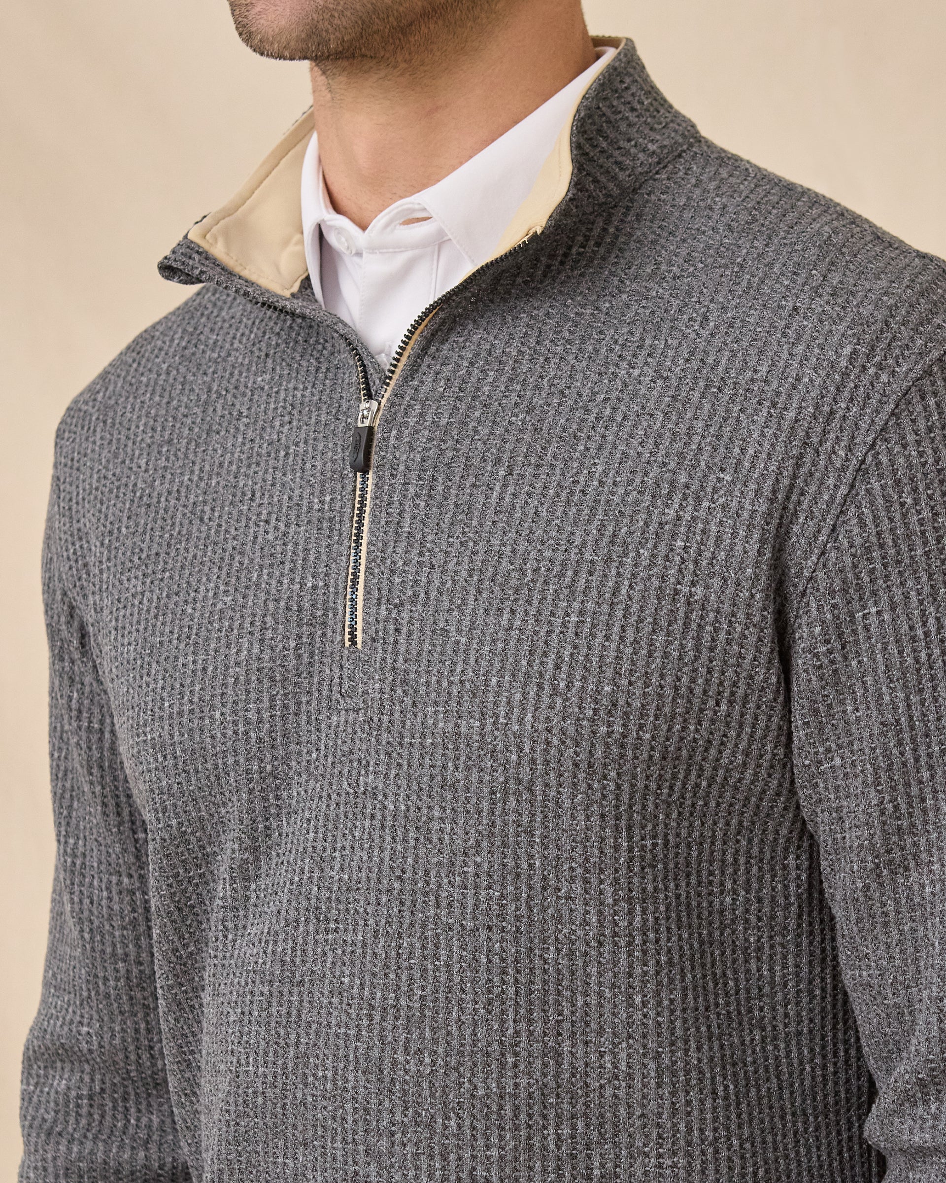 Close-up of the Huntington Quarter Zip highlighting the waffle-knit texture, contrast collar lining, and zipper.