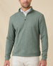 Model wearing the Dark Forest Huntington Quarter Zip layered over a white polo with light-colored pants.