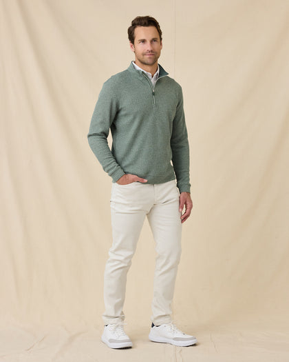 Model wearing the Dark Forest Huntington Quarter Zip with light-colored pants and white sneakers.