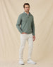 Model wearing the Dark Forest Huntington Quarter Zip with light-colored pants and white sneakers.