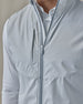 Men's Zephyr Hybrid Vest in Silver, close-up front view highlighting the full zip closure detail and chest pocket on the solid light gray body