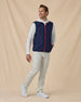 Men’s Zephyr Hybrid Vest in New Indigo / Flag Red, styled full outfit view with light pants