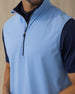 Men's Carson Vest in Carolina, on model close-up view of the quarter zip and navy collar interior detail layered over a navy polo