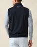 Men's Delta 2.0 Quilted Hybrid Vest in Black, back view on model featuring the Straight Down logo at the upper back, layered over a gray long sleeve shirt, paired with white pants