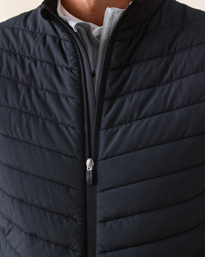 Men's Delta 2.0 Quilted Hybrid Vest in Black, close-up front view on model highlighting the quilted panel texture and full zip closure detail