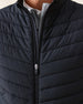 Men's Delta 2.0 Quilted Hybrid Vest in Black, close-up front view on model highlighting the quilted panel texture and full zip closure detail