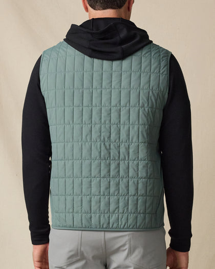 Back view of the Big Horn Vest in Dark Forest, highlighting the lightweight grid-quilted construction and clean finish.