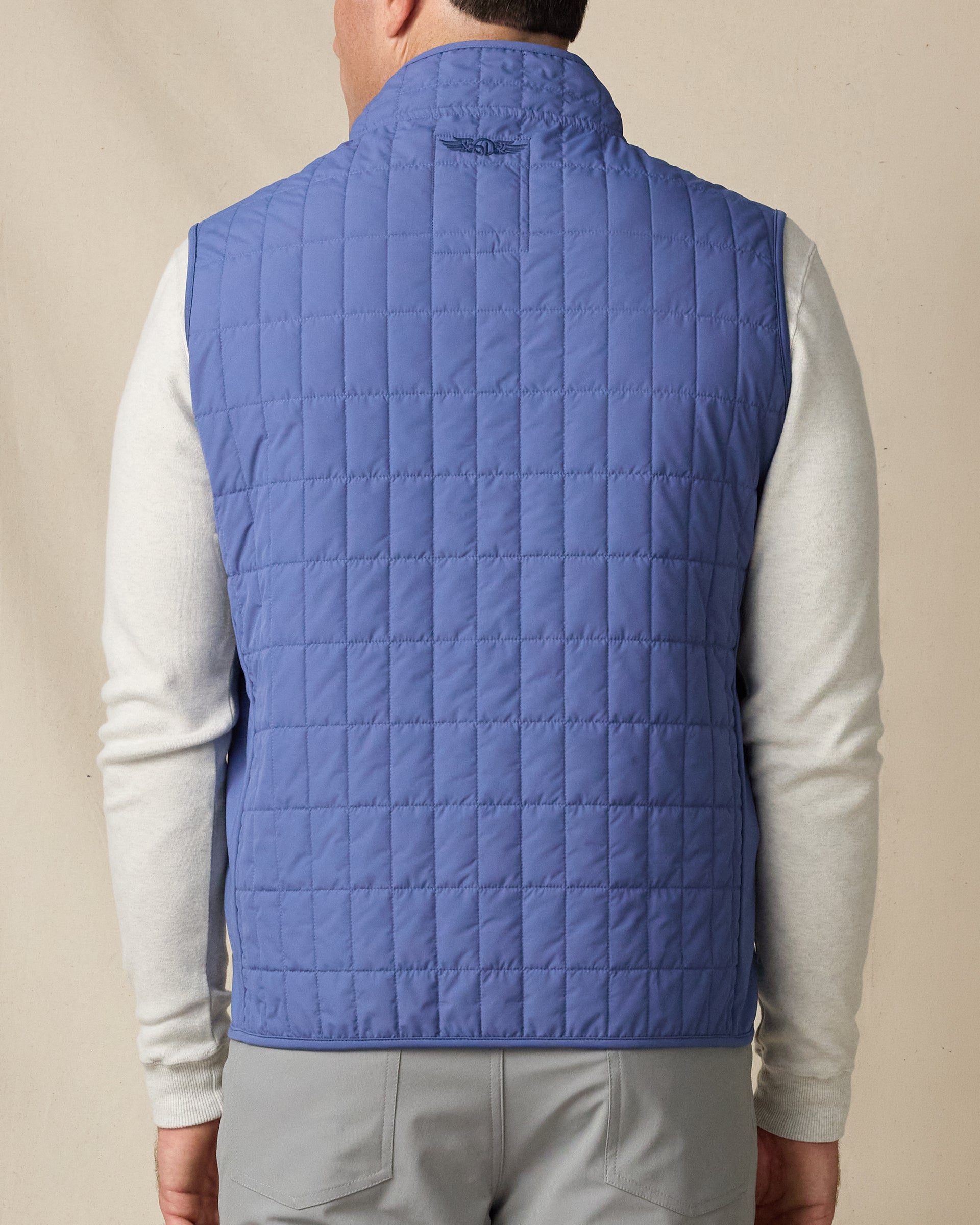 Back view of the Big Horn Vest in Moonlight, highlighting the grid-quilted construction and embroidered Straight Down logo at the collar.
