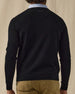 Men's Ballesteros V-Neck Sweater in Black, on model back view featuring a black fine knit v-neck sweater with Straight Down logo at the upper back and ribbed cuffs and hem