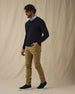 Men's Ballesteros V-Neck Sweater in Black, on model front full-length view featuring a black fine knit v-neck sweater worn over a light blue polo paired with khaki pants and shoes