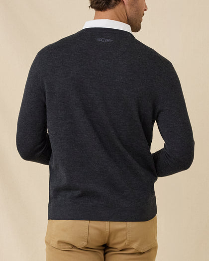 Back view of the Dark Grey Heather Connery V-Neck Sweater featuring a subtle embroidered logo below the collar.