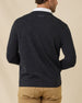 Back view of the Dark Grey Heather Connery V-Neck Sweater featuring a subtle embroidered logo below the collar.
