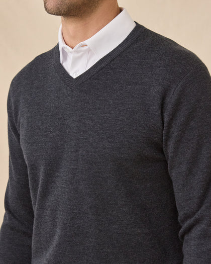 Close-up of the Dark Grey Heather Connery V-Neck Sweater showing the fine knit texture and ribbed V-neck over a white collared shirt.
