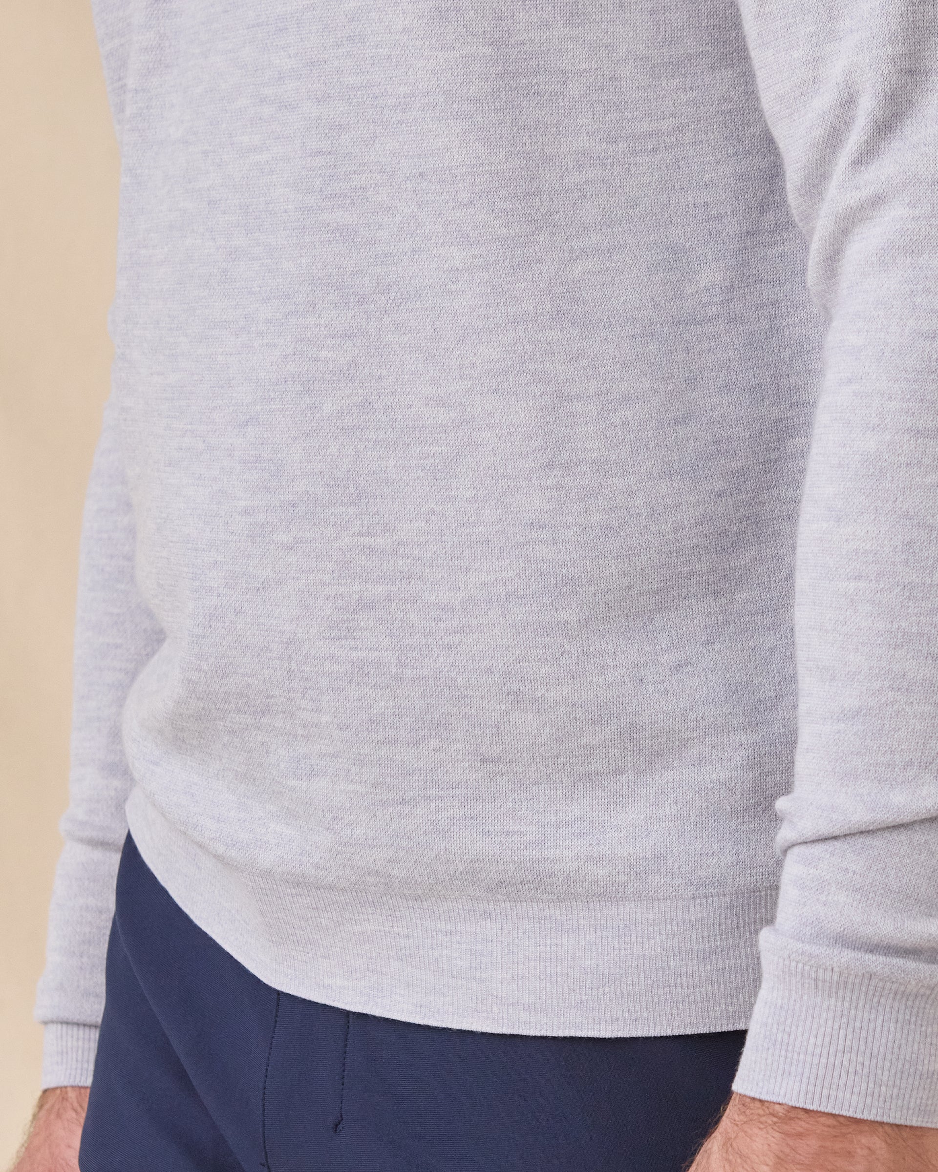 Close-up of the Light Grey Connery V-Neck Sweater showing the fine knit texture and ribbed hem and cuff.