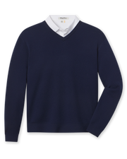 A navy blue V-neck knit sweater styled with a white collared shirt underneath.