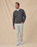 Wallace V-Neck Sweater in Dark Grey Heather with white pants, full outfit view layered over white polo and styled with light pants