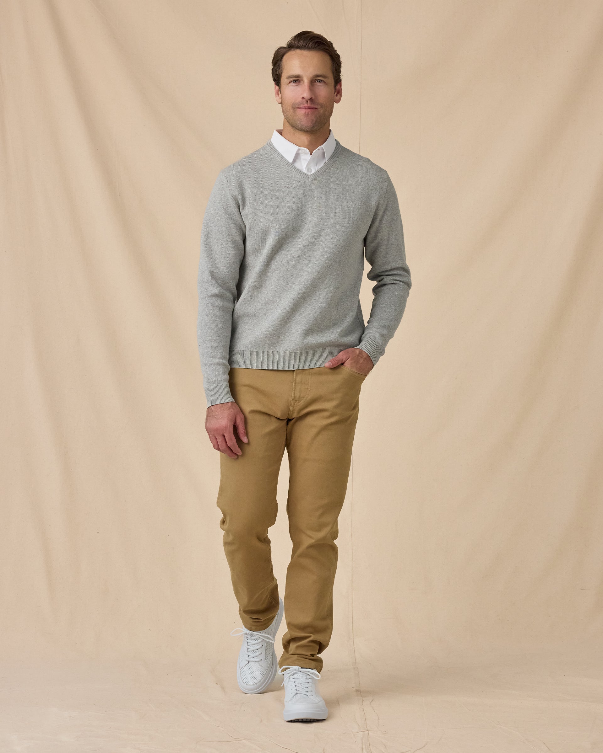 Wallace V-Neck Sweater in Light Grey Heather with khaki pants, full outfit view layered over white polo and styled with khaki pants