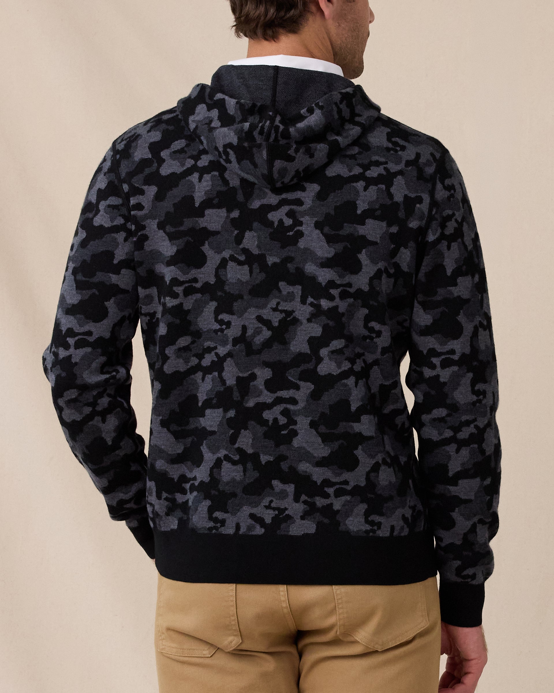 Back view of the Crenshaw Reversible Sweater Hoodie in Charcoal showing the all-over black and gray camouflage pattern and hood.