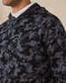 Close-up of the Crenshaw Reversible Sweater Hoodie in Charcoal highlighting the camouflage knit pattern, hood, and shoulder seam.