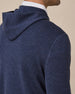 Close-up back view of the Crenshaw Reversible Sweater Hoodie in New Indigo highlighting the hood and fine merino wool knit texture