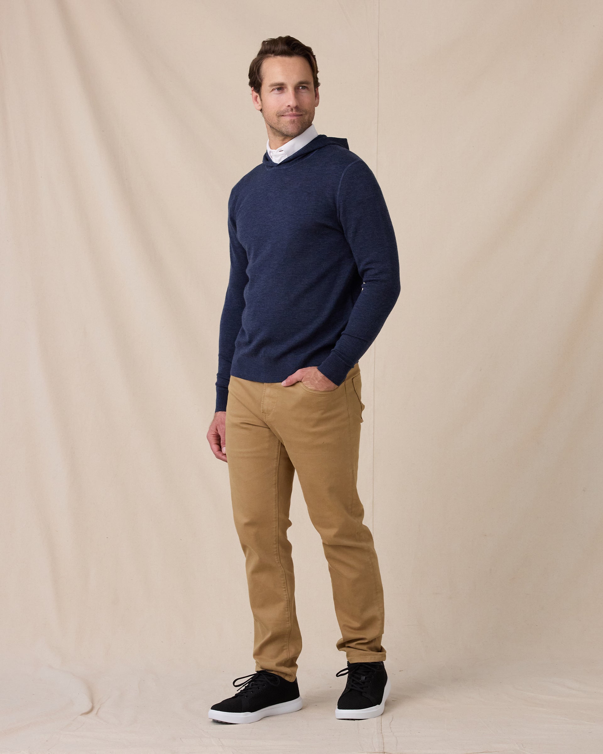 Model styled in the Crenshaw Reversible Sweater Hoodie in New Indigo with khaki pants, full outfit
