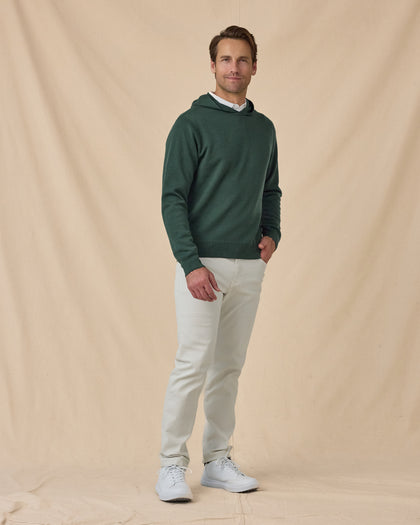 Hickam Reversible Sweater Hoodie in Dark Forest with white pants, full outfit view styled with light pants
