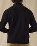 Men's Sarazen Knit Bomber in Black, on model back view featuring a black fine knit bomber with Straight Down logo at the upper back and ribbed hem