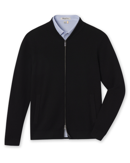 Men's Sarazen Knit Bomber in Black, flat lay front view featuring a full-zip black fine knit bomber with stand collar, side pockets, and gunmetal zipper hardware worn over a light blue polo