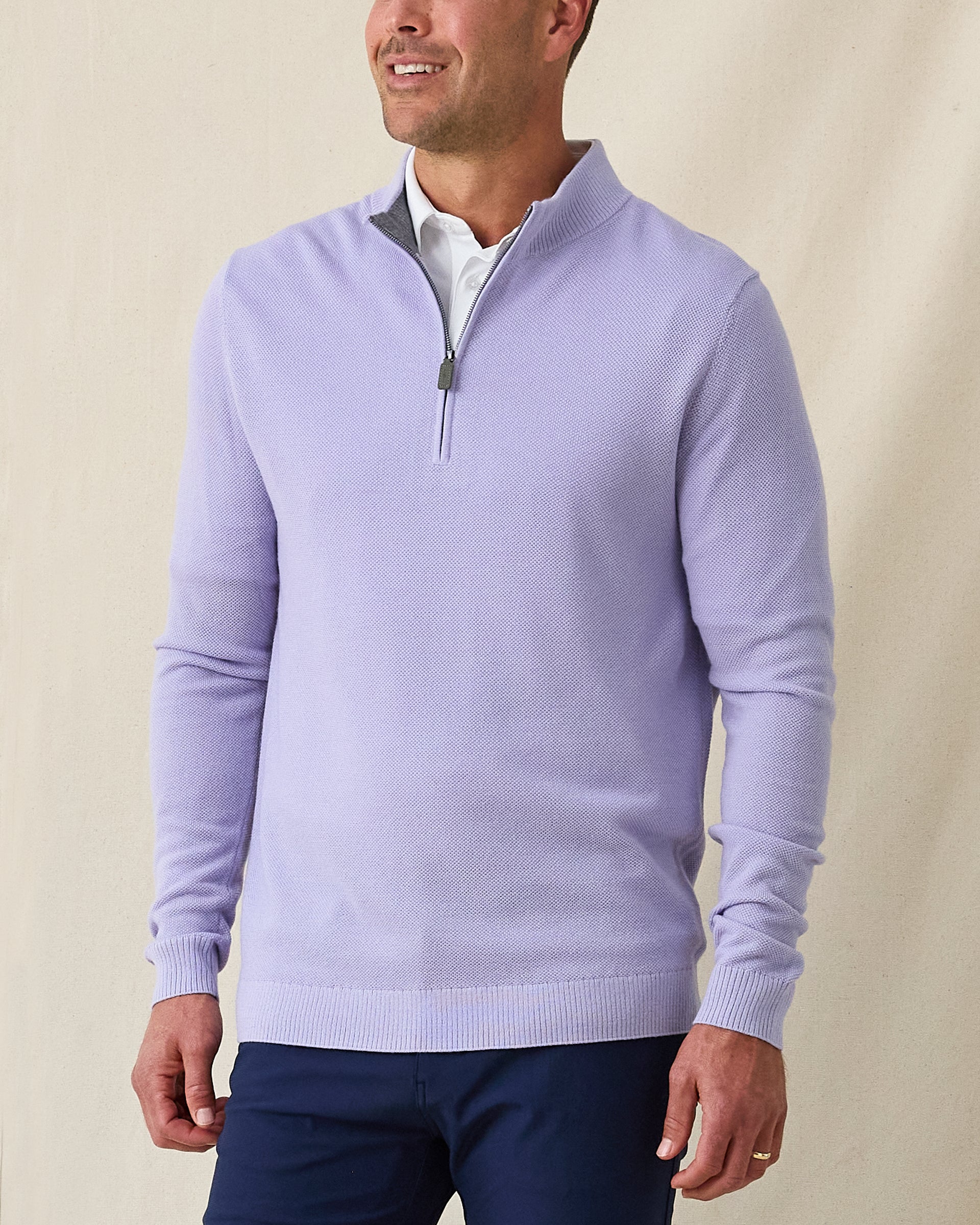 Men's St. Andrews Quarter Zip in Violet Heather, front view on model featuring a textured knit with gray interior lining and silver zipper with olive pull tab, layered over a white polo, paired with navy pants