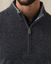 Men's Lakeside Quarter Zip Sweater in Charcoal Heather, on model front close-up view featuring fine knit texture detail, light grey contrast stand collar, and olive green Straight Down branded leather zipper pull