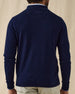 Men's Lakeside Quarter Zip Sweater in New Indigo, back view on model featuring a solid navy knit body with the Straight Down logo embroidered at the upper back, worn with light grey pants