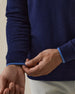 Men's Lakeside Quarter Zip Sweater in New Indigo, close-up cuff view featuring the navy knit body with a light blue tipped ribbed cuff detail