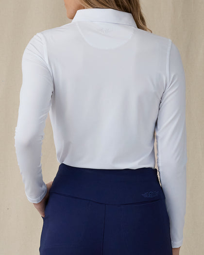 Midday Long Sleeve Polo in White, back view on model showing a smooth long sleeve polo with Straight Down logo embroidered at the upper back, paired with navy pants