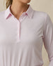 Close-up detail of the Midday Long Sleeve Polo in Pale Pink highlighting the structured collar and button placket